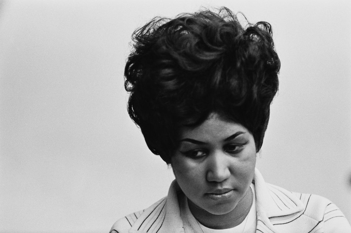 Black and white close-up of Aretha Franklin looking down during a recording session at Atlantic Studios, New York, 1969