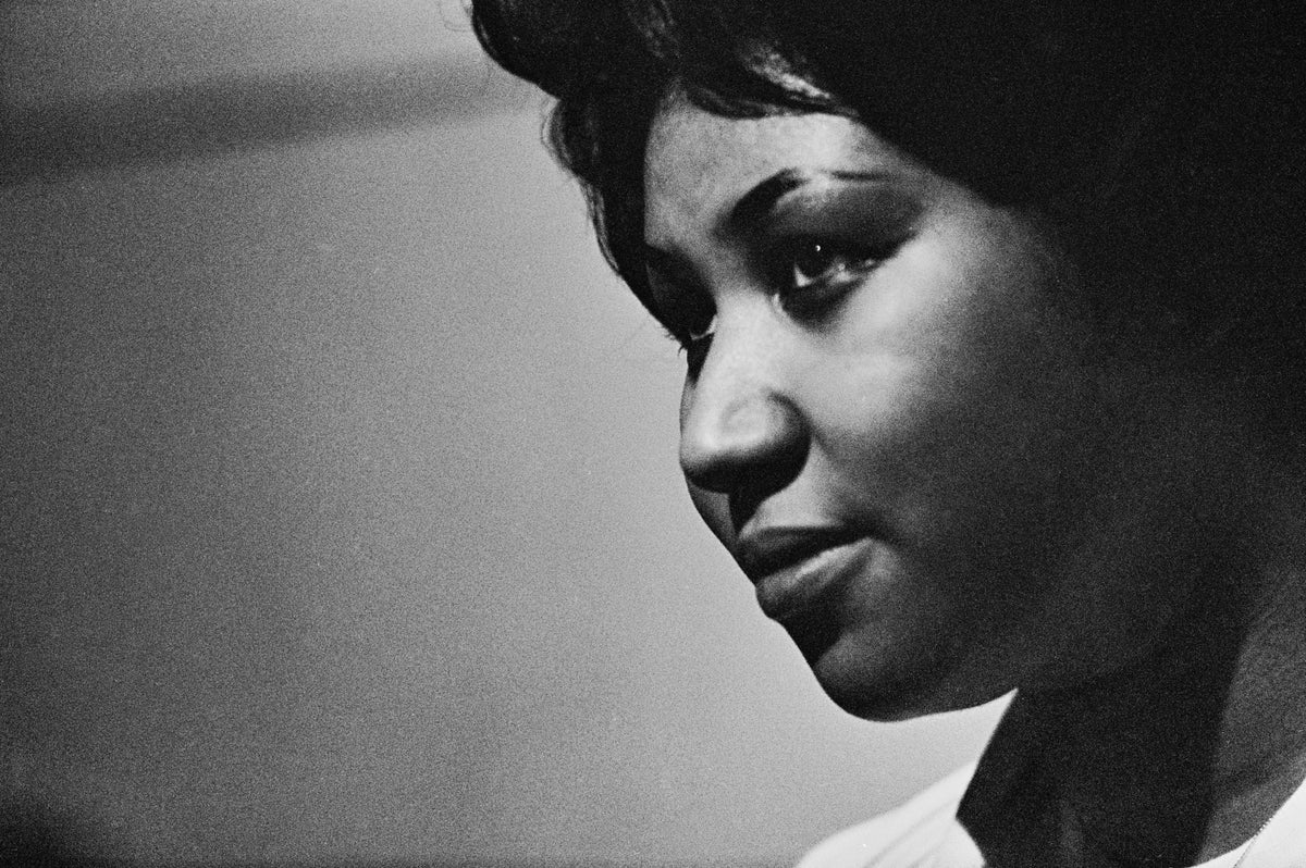 Black and white close-up profile of Aretha Franklin during a recording session at Atlantic Studios, New York, 1969