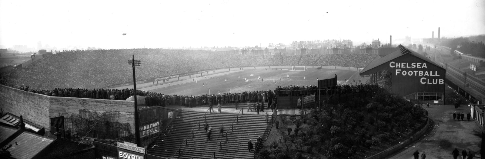 Black and white panoramic photograph of a packed Stamford Bridge stadium during the 1920 FA Cup Final