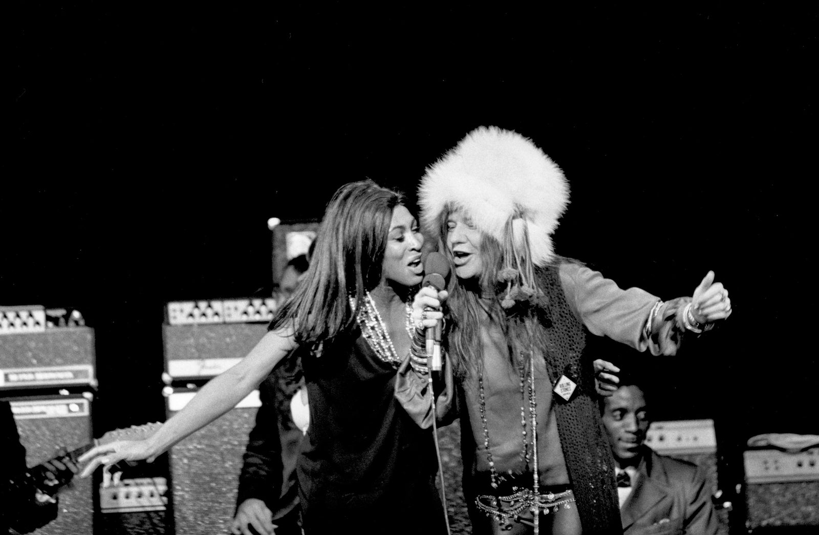 Black and white photograph of Janis Joplin and Tina Turner singing together on stage, Los Angeles, 1969