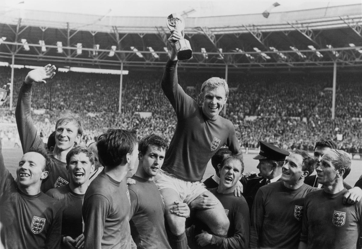 World Cup Victory by Central Press/Getty Images, 1966. England captain Bobby Moore holds up the Jules Rimet trophy as he is carried on the shoulders of his team-mates after their 4-2 victory over West Germany in the World Cup Final at Wembley Stadium.. Open Edition Resin Photographic Print. Landscape orientation. Available at Electric Gallery, London, UK.