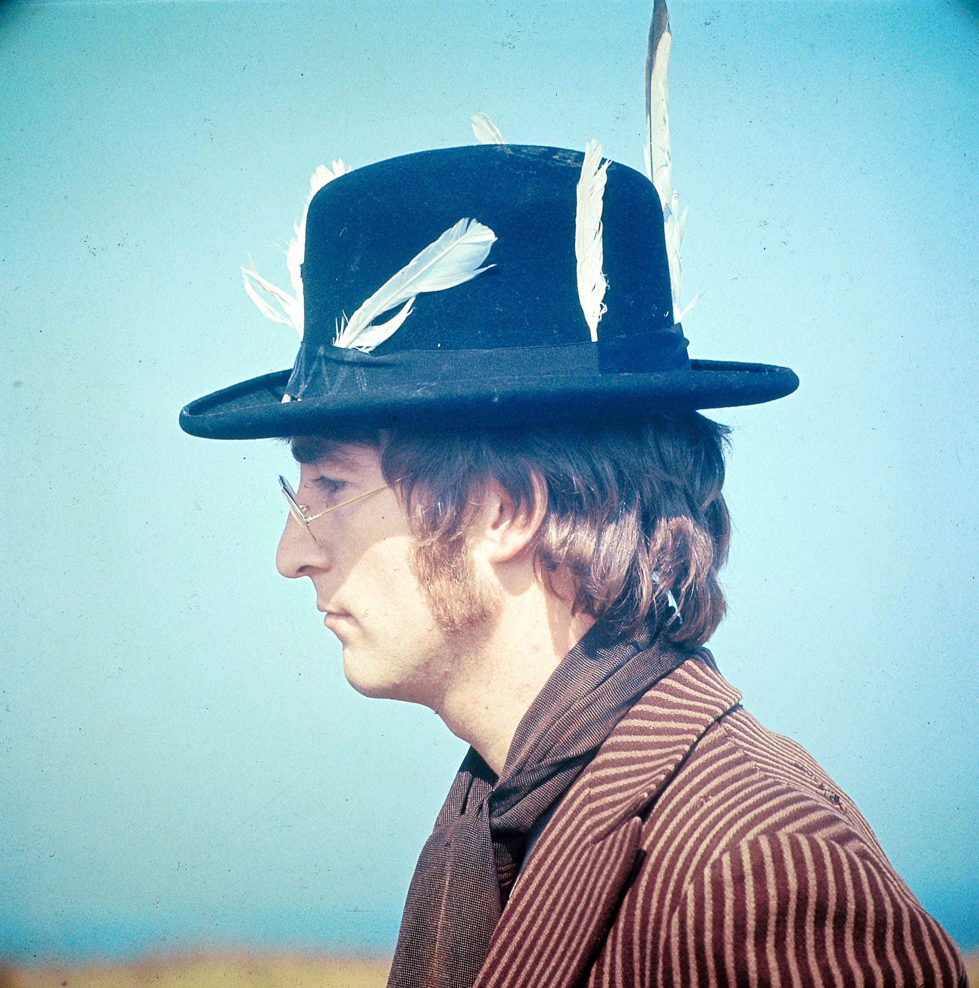 John Lennon by David Redfern/Getty Images, 1967. Photo of John LENNON; of The Beatles, posed, during filming of Magical Mystery Tour.. Open Edition C-Type Photographic Print. Square orientation. Available at Electric Gallery, London, UK.