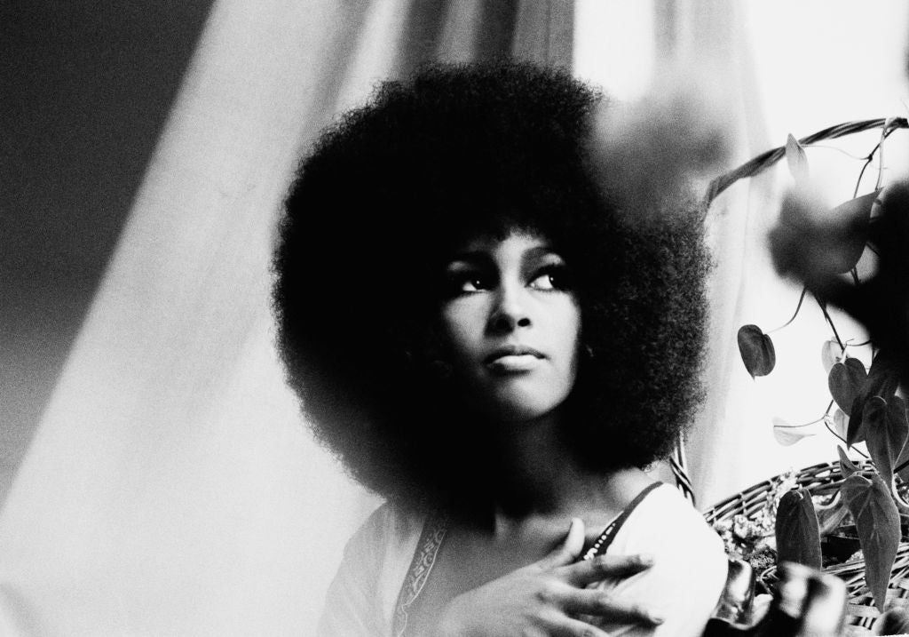 Black and white portrait of Marsha Hunt with her voluminous afro hair, UK, 1968