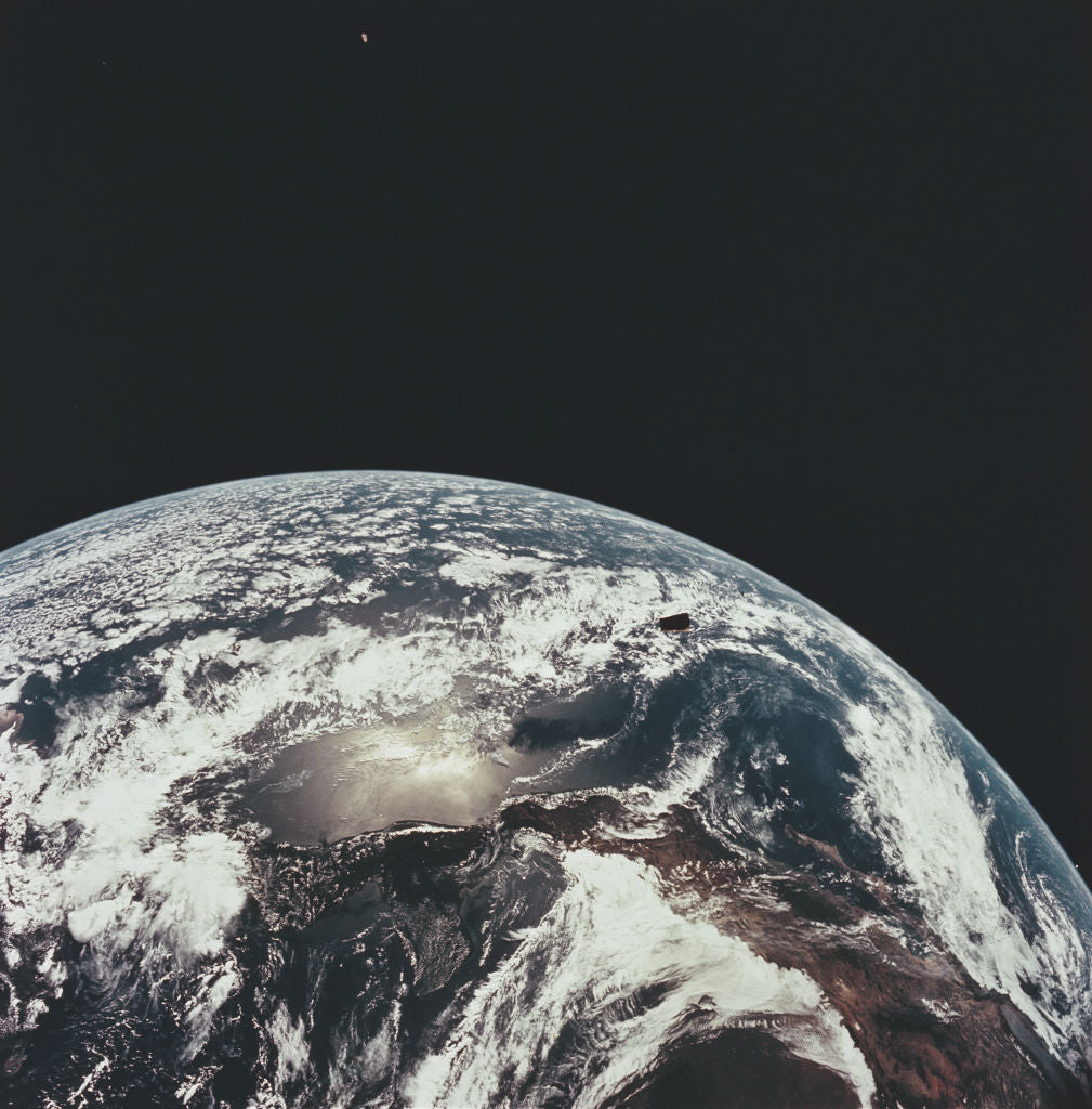 Colour photograph of Earth from space on NASA's Apollo 12 mission, showing the coast of Mexico and the Pacific Ocean under swirling cloud, 1969