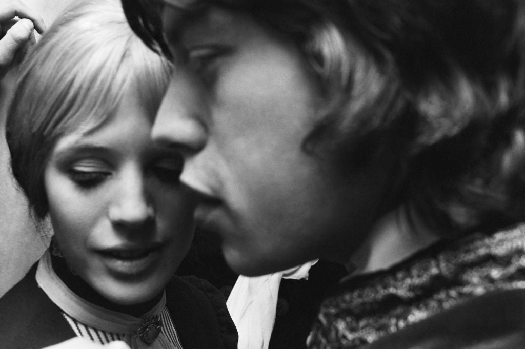 Black and white close-up of Marianne Faithfull and Mick Jagger backstage at the Royal Court Theatre, London, 1967