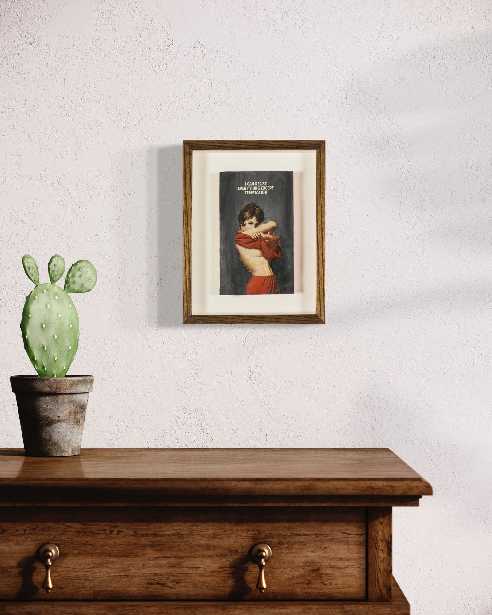 I Can Resist Everything Except Temptation – Grey (Framed) by The Connor Brothers, a limited edition hand painted vintage paperback book with silkscreen from 2019