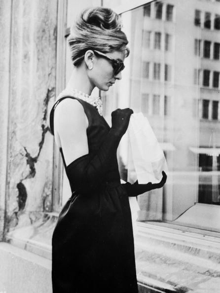 Lunch On Fifth Avenue by Keystone Features/Getty Images, 1961. Audrey Hepburn stops for lunch on Fifth Avenue in New York during location filming for 'Breakfast At Tiffany's', directed by Blake Edwards in which she stars as Holly Golightly.. Open Edition Resin Photographic Print. Portrait orientation. Available at Electric Gallery, London, UK.