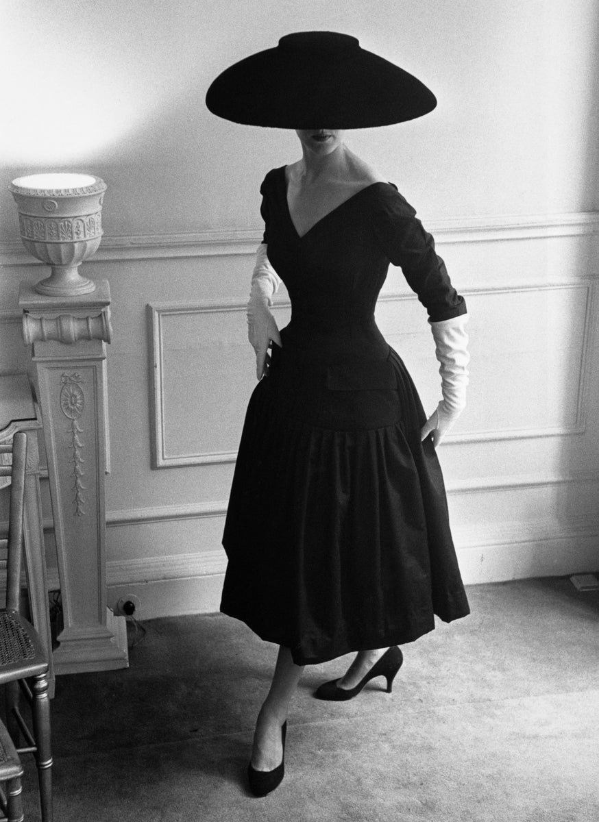 New Look by Kurt Hutton/Getty Images, 1955. A model wearing a black cocktail dress and a black velvet wide-brimmed hat, designed by Ronald Paterson.. Open Edition Resin Photographic Print. Portrait orientation. Available at Electric Gallery, London, UK.