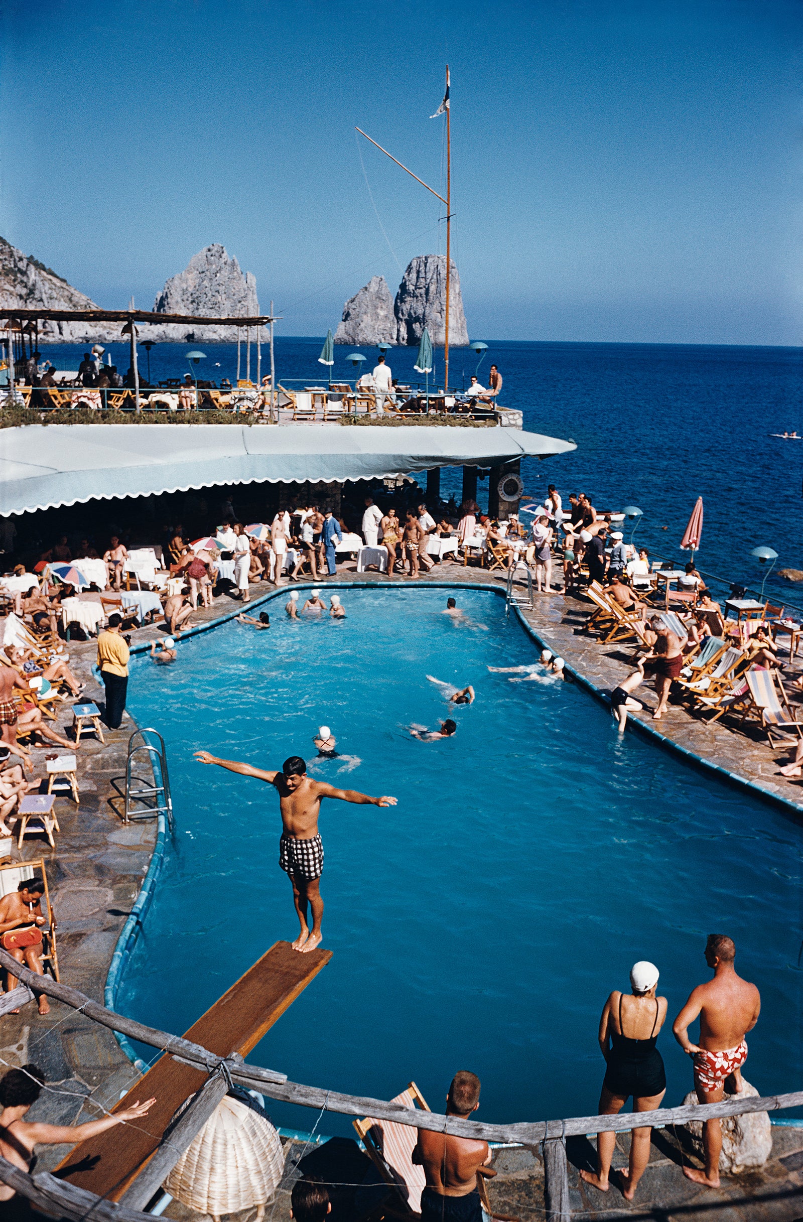 Marina Piccola by Slim Aarons/Getty Images, 1954. Canzone del Mare at the Marina Piccola, Capri, Italy. Open Edition C-Type Photographic Print.. Portrait orientation. Available at Electric Gallery, London, UK.