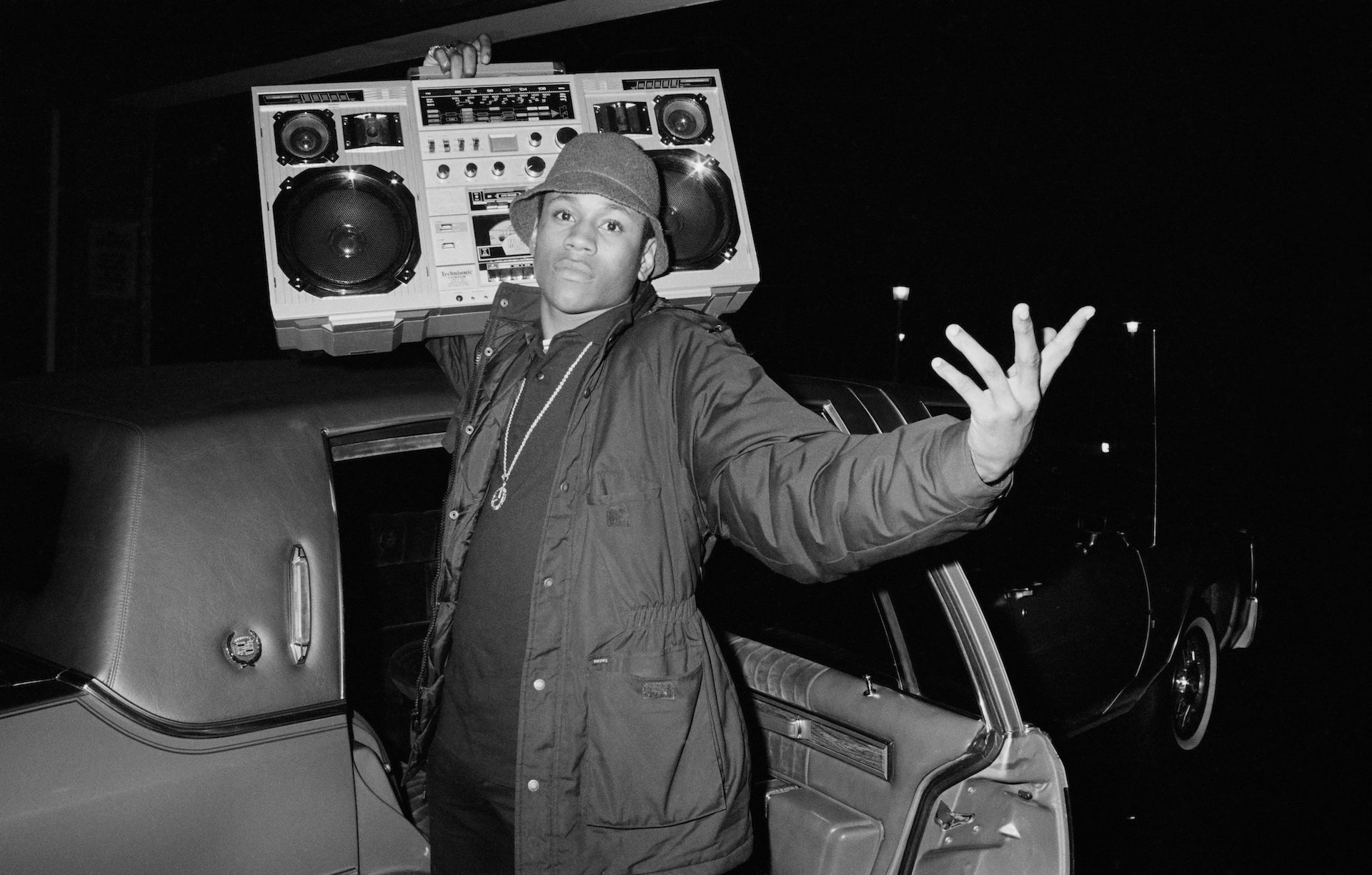 LL Cool J by Michael Ochs/Getty Images, 1986. Rapper LL Cool J holds a boombox outside a concert, circa. Open Edition Resin Photographic Print. Landscape orientation. Available at Electric Gallery, London, UK.