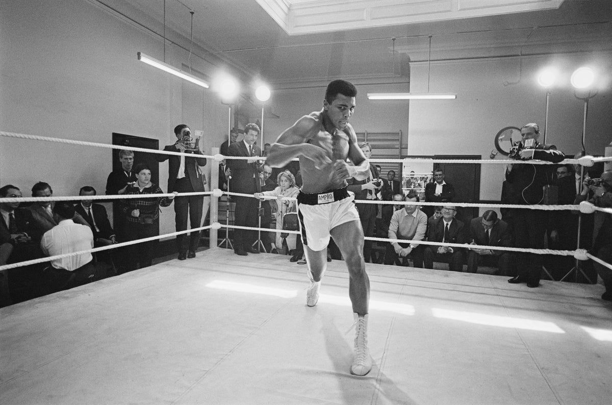 Ali In Training by Russell McPhedran/Getty Images, 1966. American heavyweight boxer Muhammad Ali throws bare-handed punches in the ring while in training for his fight against Brian London, London, England. Open Edition Resin Photographic Print. Landscape orientation. Available at Electric Gallery, London, UK.