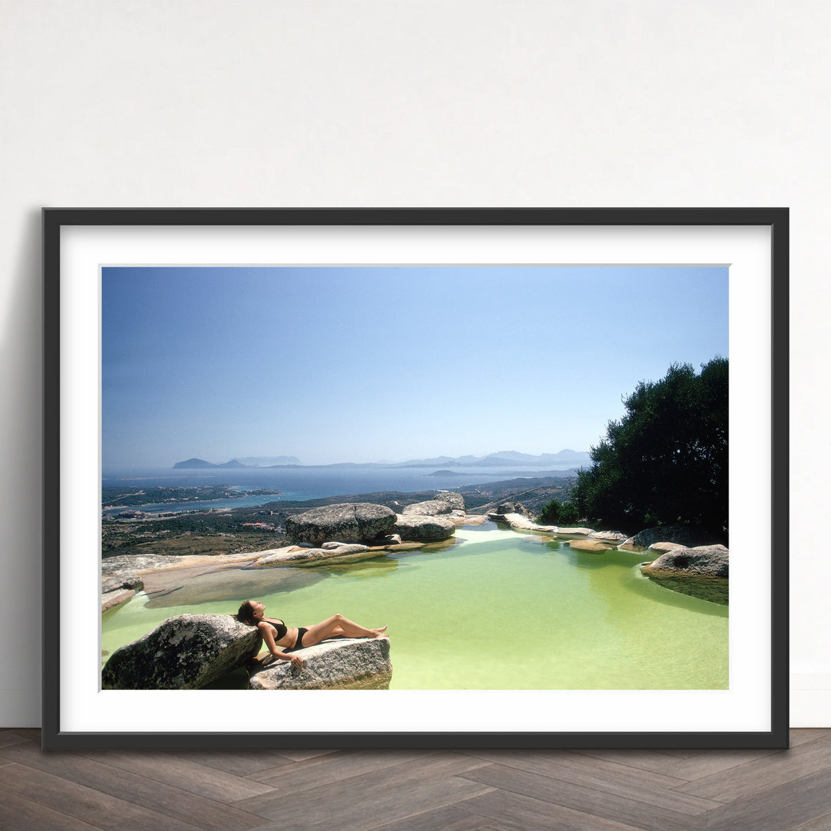 Slim Aarons - sunbather on rock - Photography - Getty Images