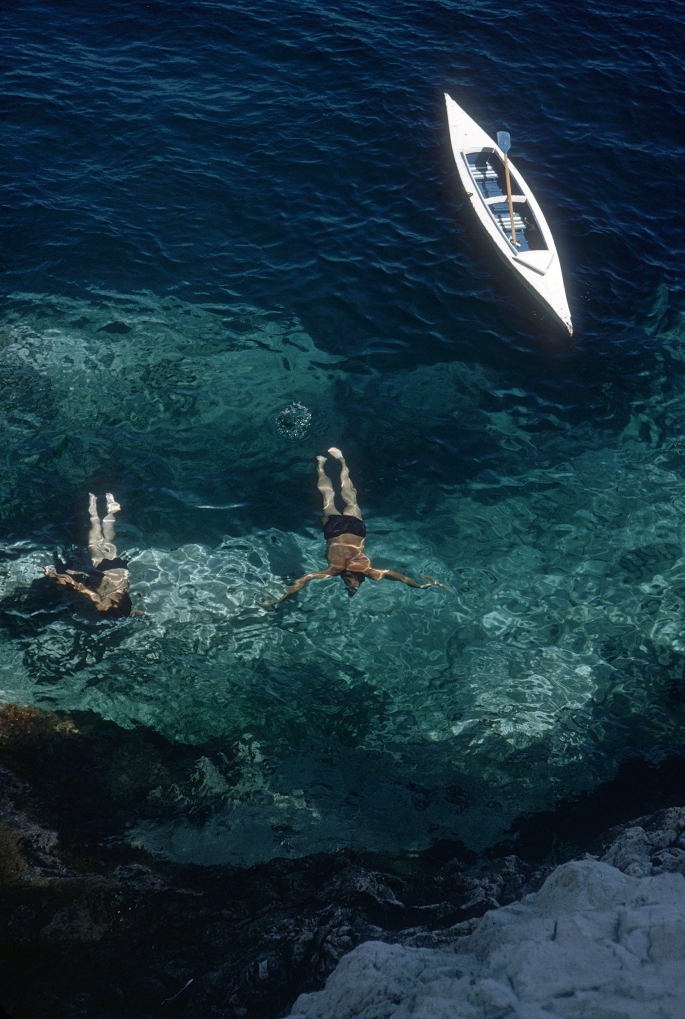 Capri Holiday by Slim Aarons/Getty Images, 1958. Swimmers off the Italian island of Capri
 . Open Edition C-Type Photographic Print. Portrait orientation. Available at Electric Gallery, London, UK.