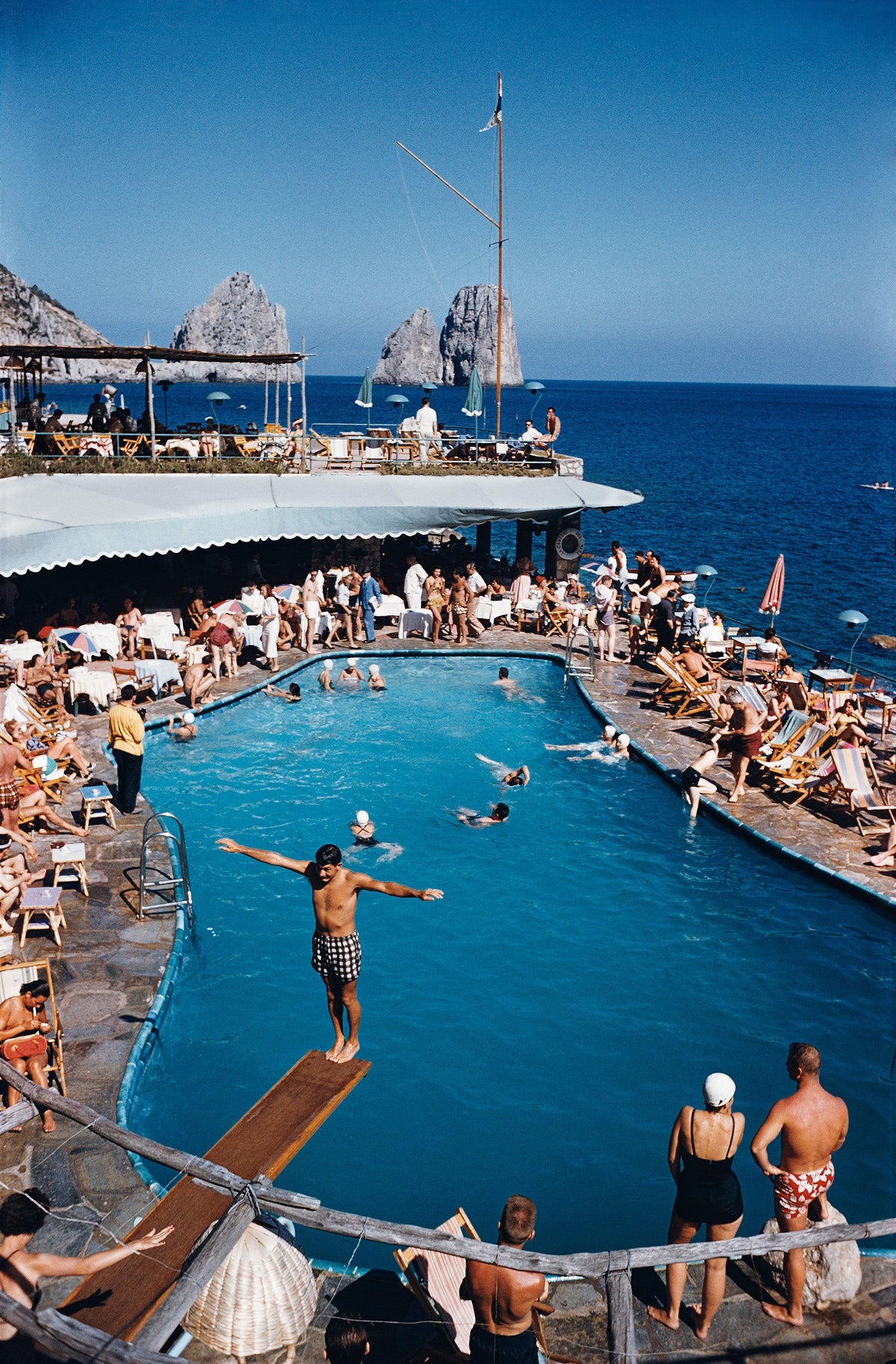 Marina Piccola by Slim Aarons/Getty Images, 1954. Canzone del Mare at the Marina Piccola, Capri, Italy. Open Edition C-Type Photographic Print.. Portrait orientation. Available at Electric Gallery, London, UK.