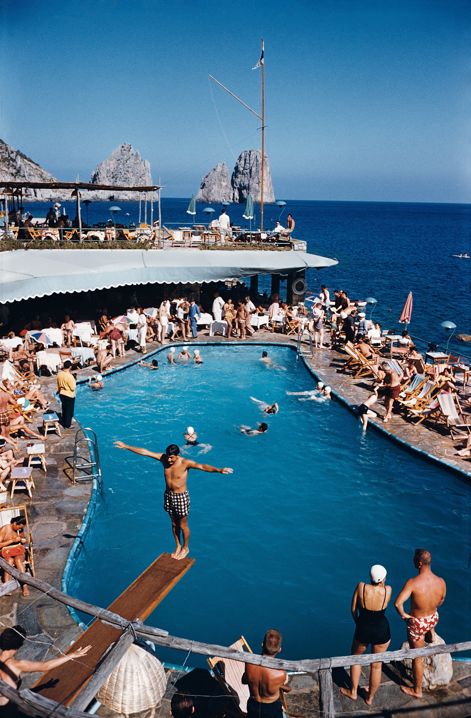 Marina Piccola by Slim Aarons/Getty Images, 1954. Canzone del Mare at the Marina Piccola, Capri, Italy. Open Edition C-Type Photographic Print.. Portrait orientation. Available at Electric Gallery, London, UK.