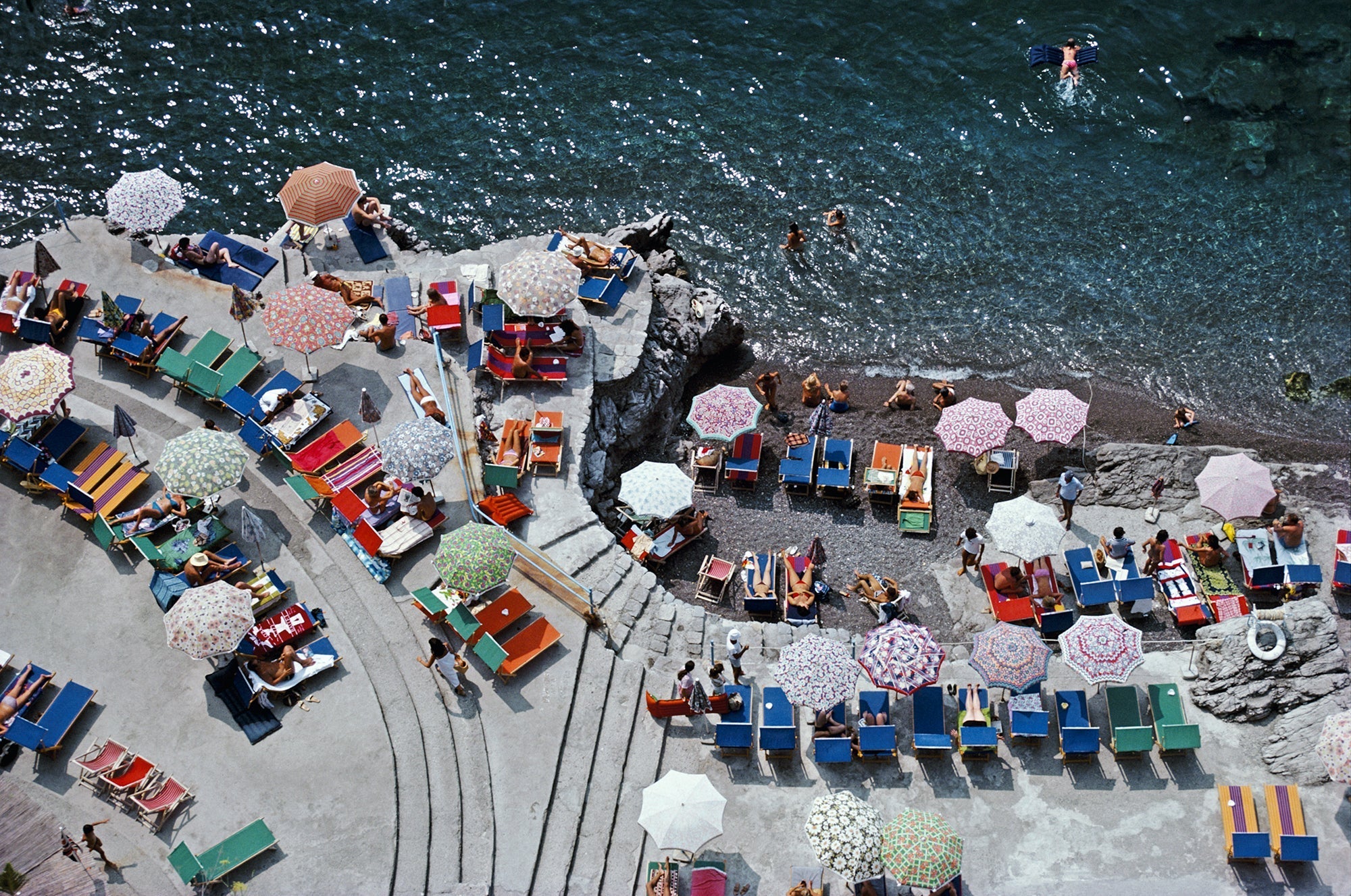 Positano Beach by Slim Aarons/Getty Images, 1979. Open Edition C-Type Photographic Print. Landscape orientation. Available at Electric Gallery, London, UK.
