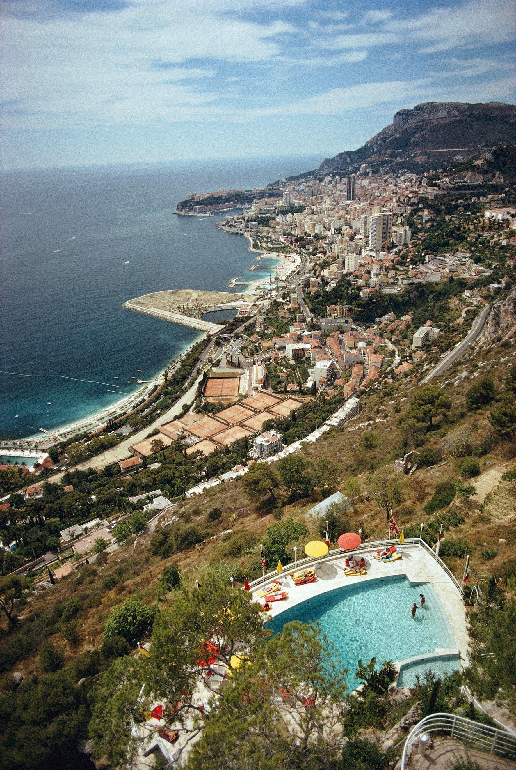 Roquebrune-Cap Martin by Slim Aarons/Getty Images, 1970. A view from a hillside in Roquebrune-Cap-Martin, southeastern France, looking toward Monaco. Open Edition C-Type Photographic Print.. Portrait orientation. Available at Electric Gallery, London, UK.