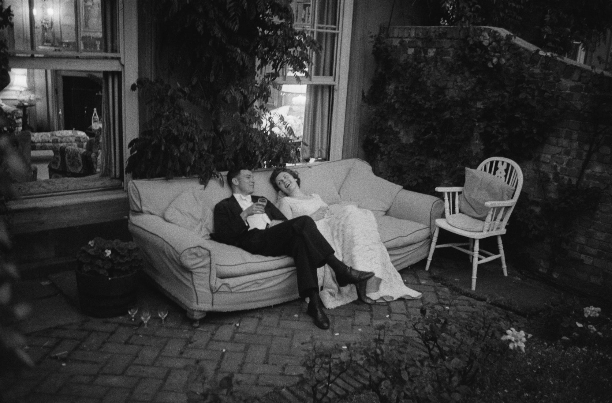 Couple At Party by Thurston Hopkins/Getty Images, 1955. A debutante at a 'Coming-Out Ball' for British actress Anna Massey in Highgate, north London.. Open Edition Resin Photographic Print. Landscape orientation. Available at Electric Gallery, London, UK.