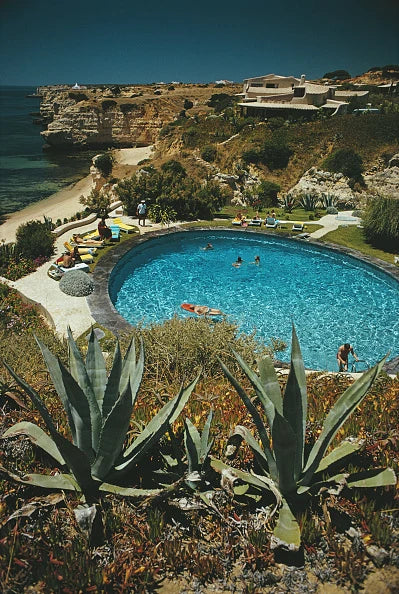 Guests in the pool at the Algarve Hotel, the Algarve, Portugal, July 1970. Slim Aarons photograph.
