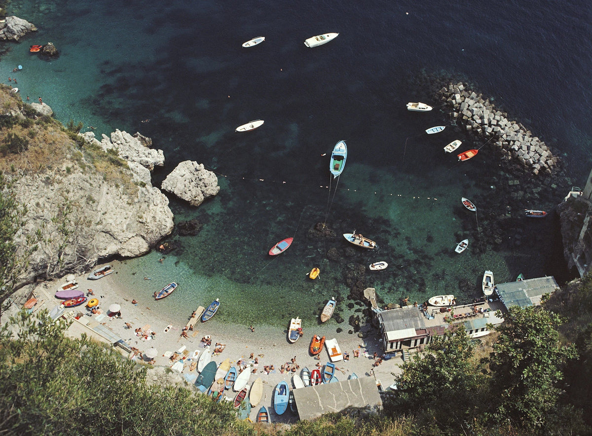 A busy bay in Conca dei Marini, on the Amalfi coast in Italy, August 1984. Slim Aarons photograph.