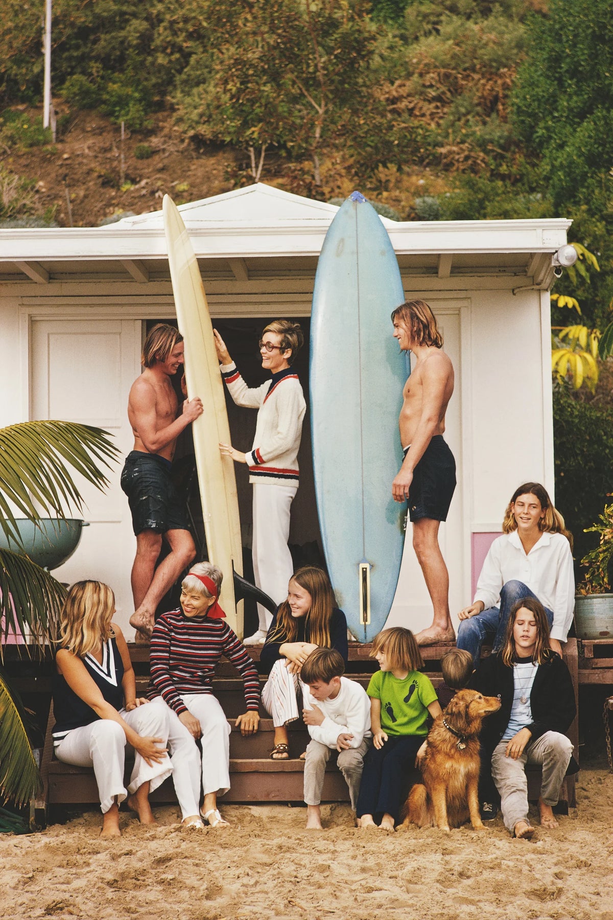 Surfers outside a beach hut in Laguna Beach, California, January 1970. Slim Aarons photograph.