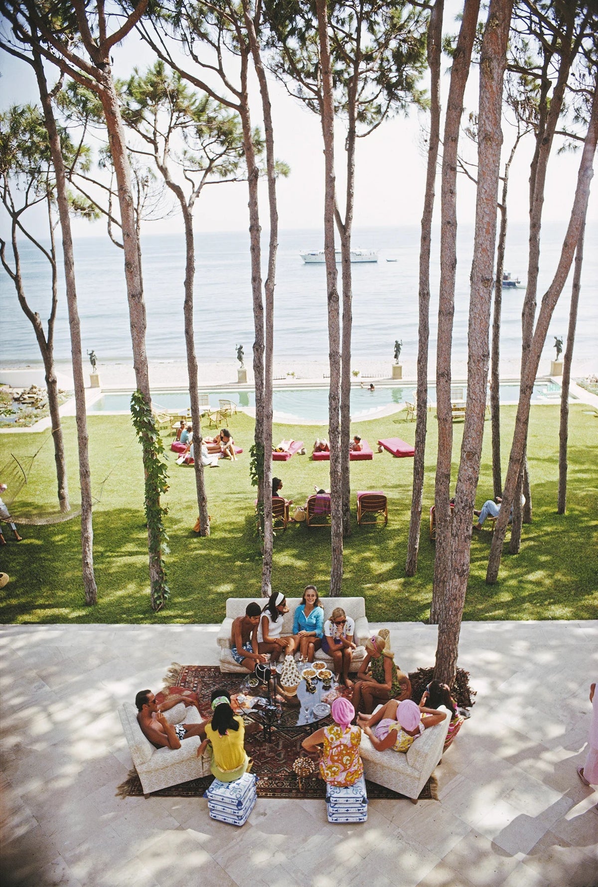 Guests at a party at the home of Sebastiano Bergese in Marbella, Spain, August 1967. Slim Aarons photograph.