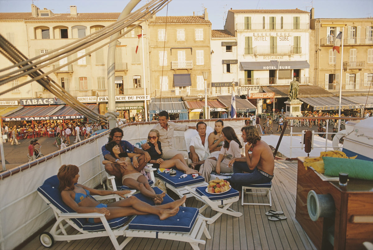 Holidaymakers on the deck of yacht in Saint-Tropez, France, August 1971. Slim Aarons photograph.