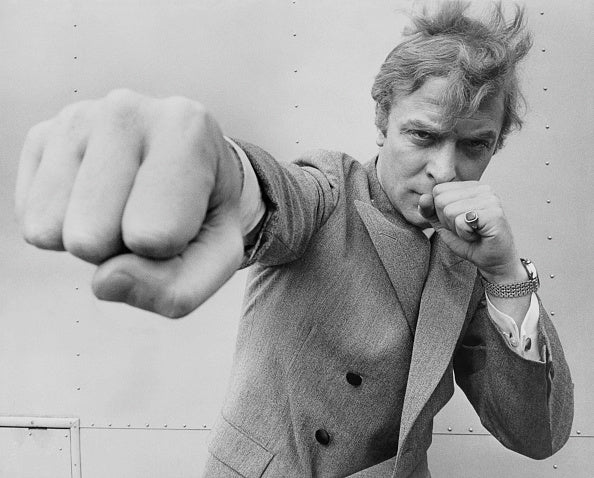 Michael Caine Throwing A Punch by Stephan C Archetti/Getty Images, 1965. English actor Michael Caine, throwing a punch. Open Edition Resin Photographic Print. Landscape orientation. Available at Electric Gallery, London, UK.