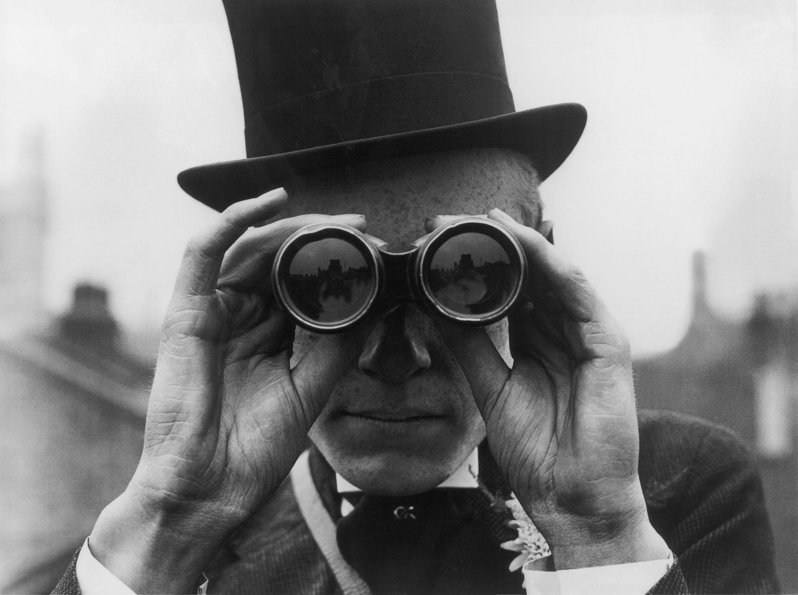 Derby Spectator by Topical Press Agency/Getty Images, 1923. A spectator looking through binoculars at the Derby horse races, Epsom, Surrey. Open Edition Resin Photographic Print. Landscape orientation. Available at Electric Gallery, London, UK.