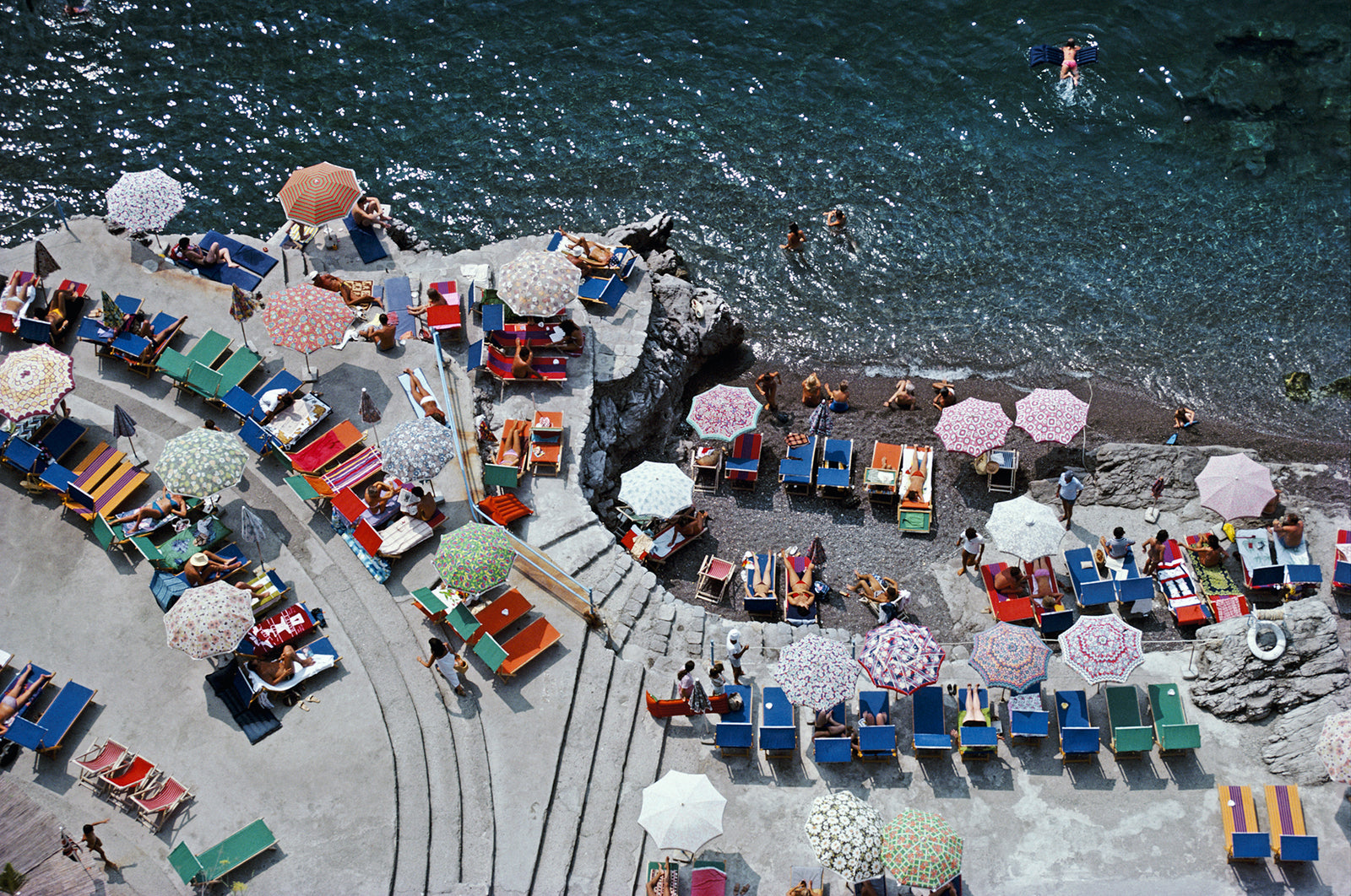 Positano Beach by Slim Aarons/Getty Images, 1979. Open Edition C-Type Photographic Print. Landscape orientation. Available at Electric Gallery, London, UK.