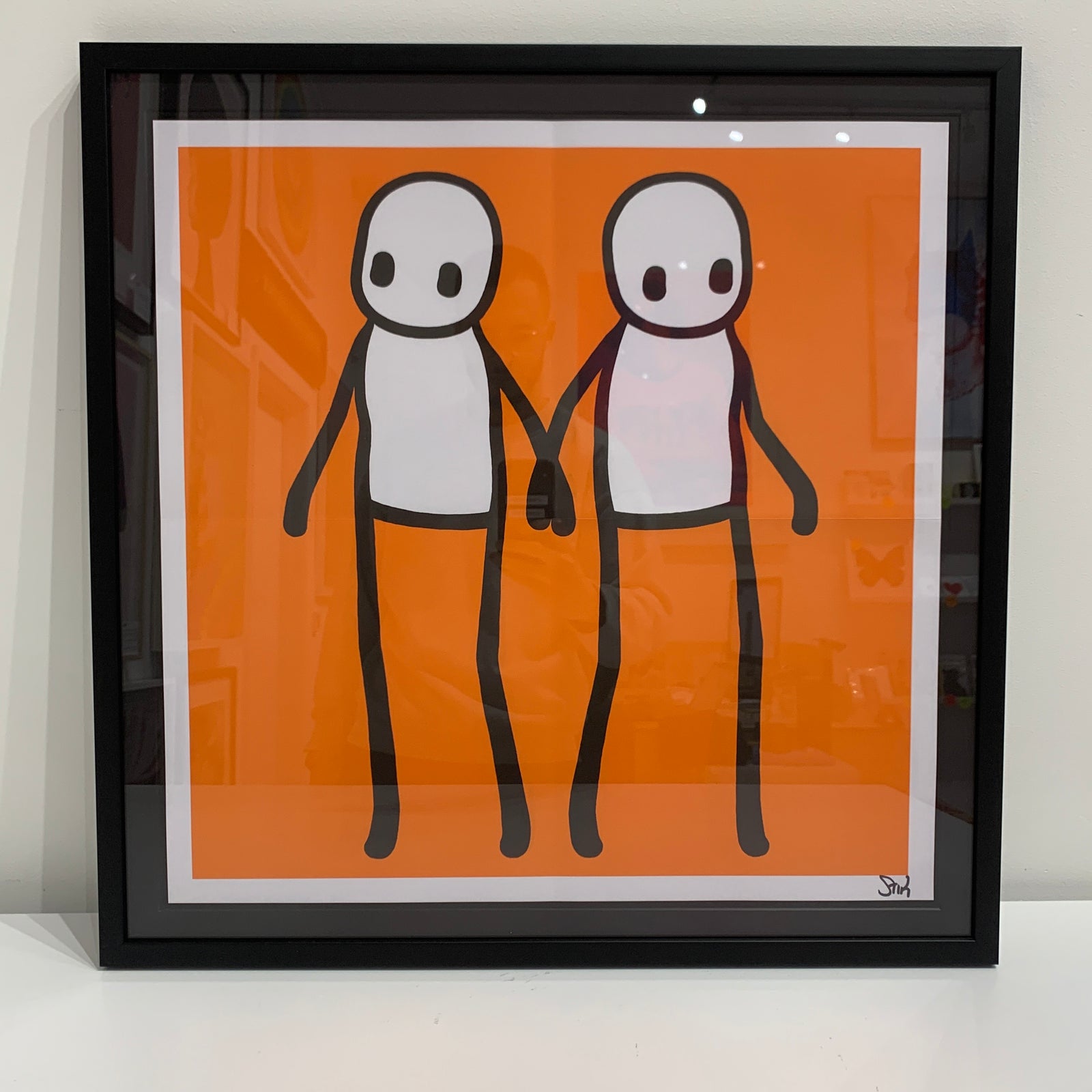Holding Hands - Orange (Signed) (Framed) by Stik, a limited edition lithographic poster in colours on 140gsm wove.  from 2020